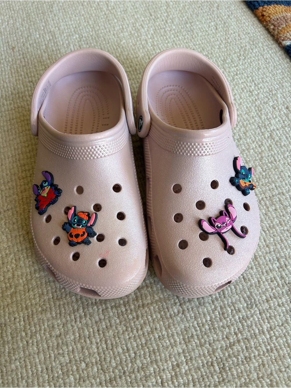 CROCS Woman’s Pale Pink Classic Clog with Character Charms